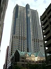 A very tall building looking up from ground level.